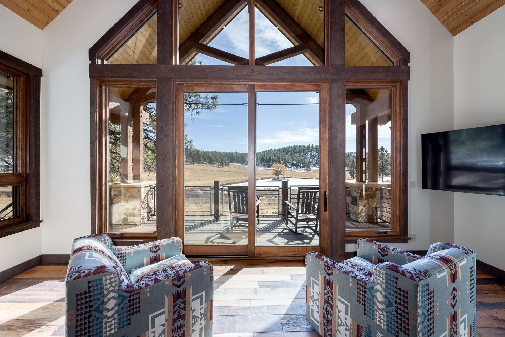 a living room with sliding glass doors installed and serviced by Sun Glass Montrose, CO