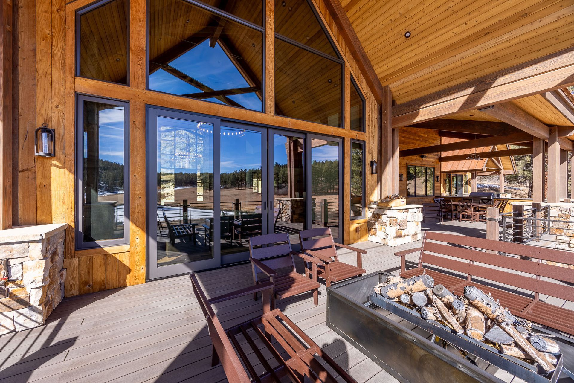 A bedroom with a large bed and a fireplace.