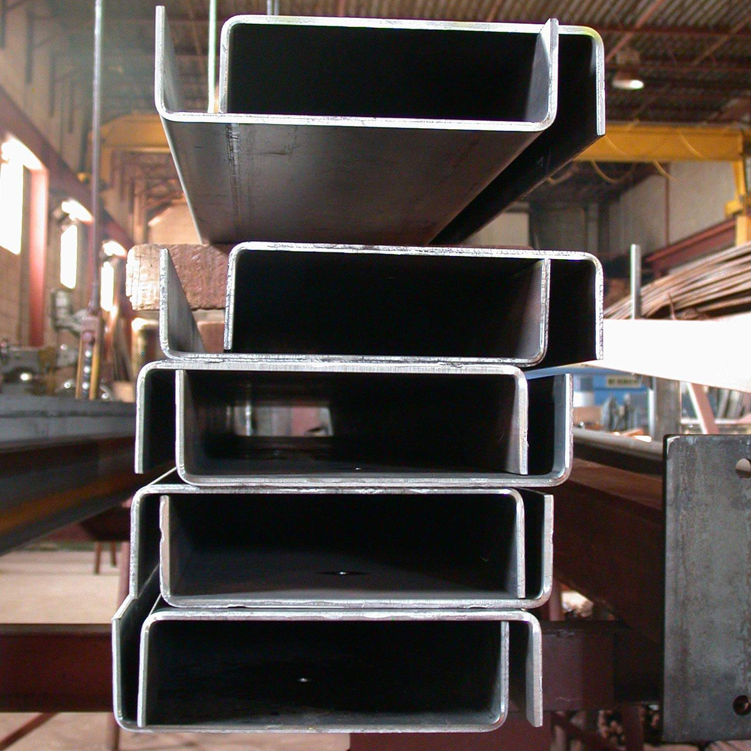 A bunch of metal tubes stacked on top of each other