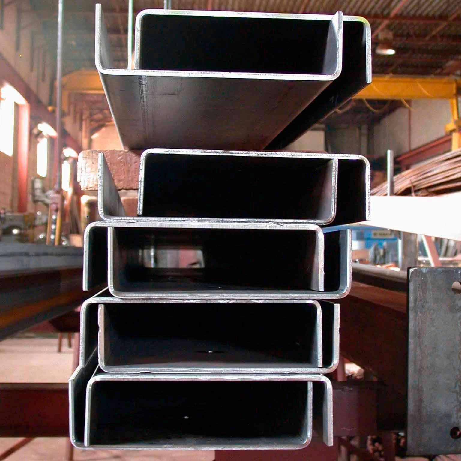 A bunch of metal tubes stacked on top of each other