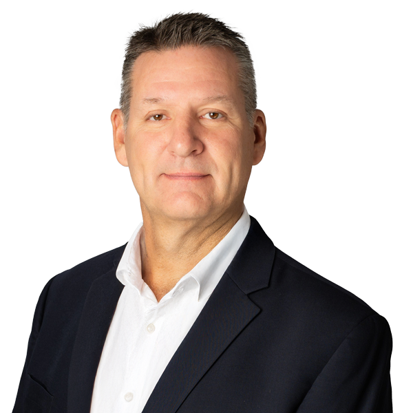 A man in a white shirt is smiling for the camera.