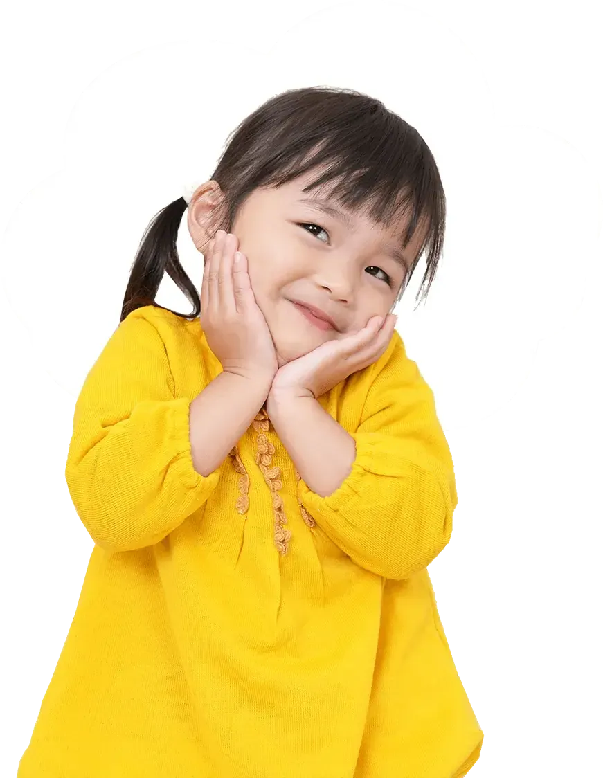 Smiling child in yellow sweater with hands on cheeks at a children’s assessment centre