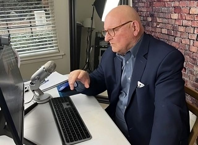 Elderly couple in a park, woman playfully riding on man's back.