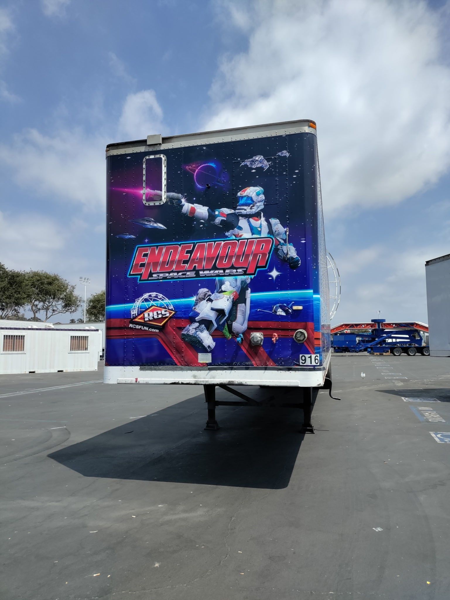 Semi-trailer with a space-themed graphic.