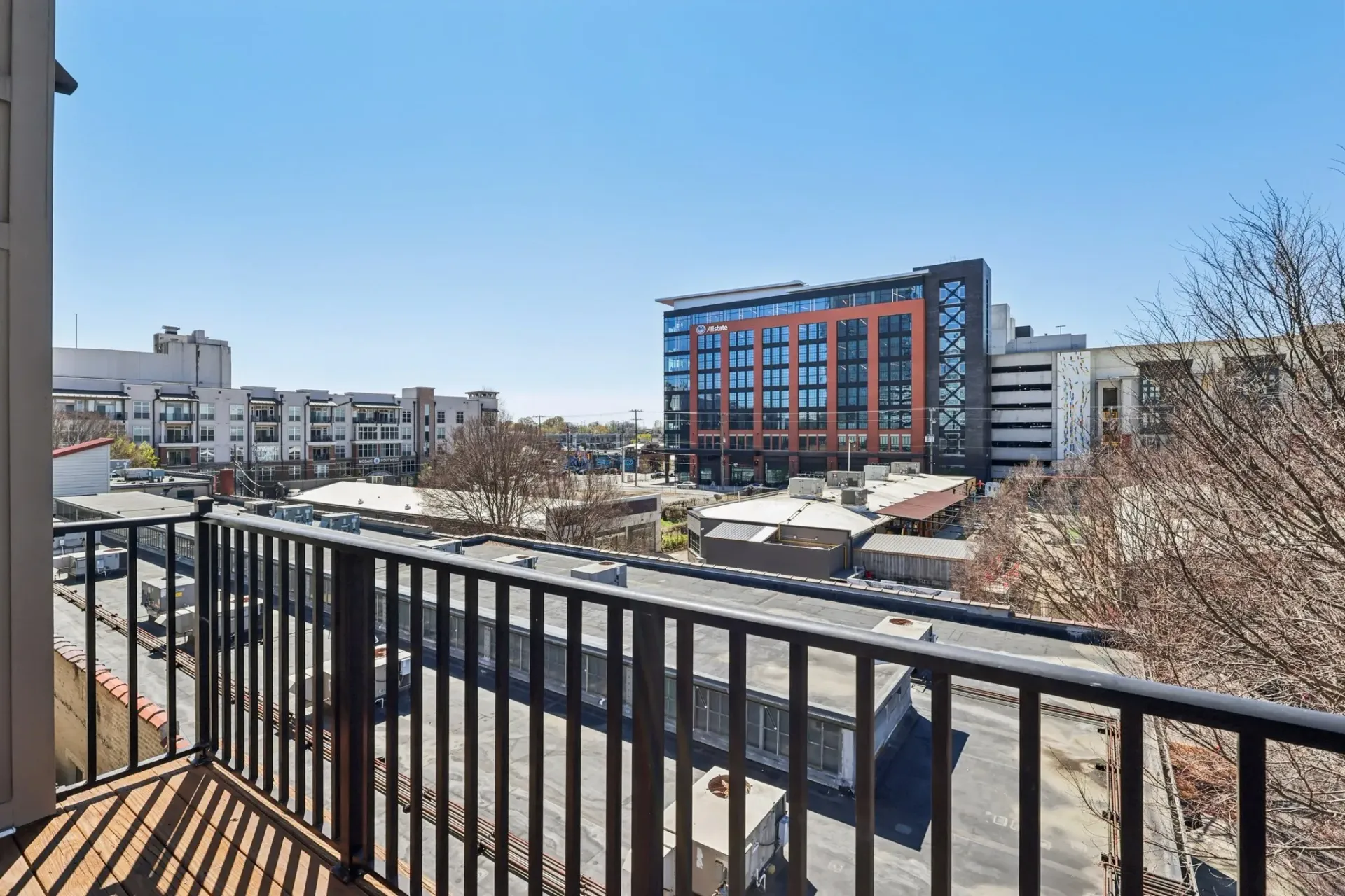 View of city buildings and apartments from a balcony.