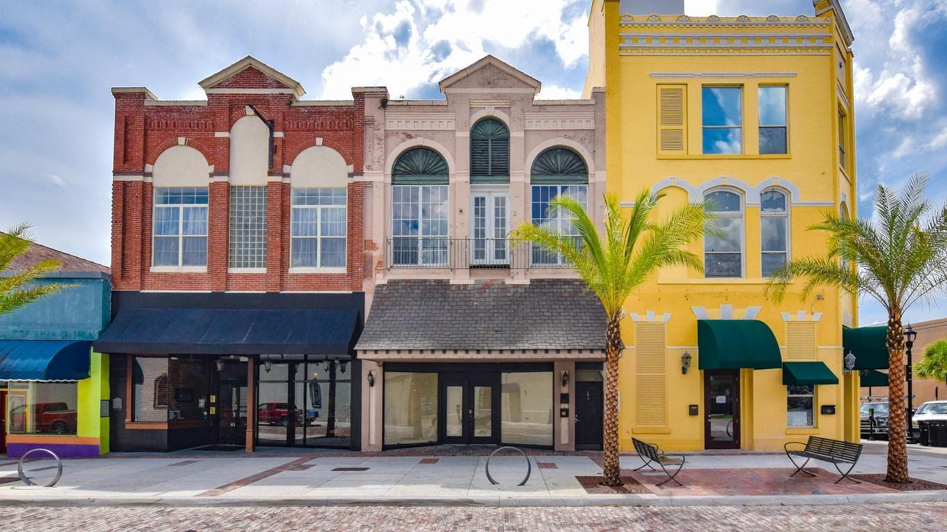 A kitchen with a large island in the middle of it.