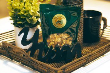 A dark-green bag of snacks