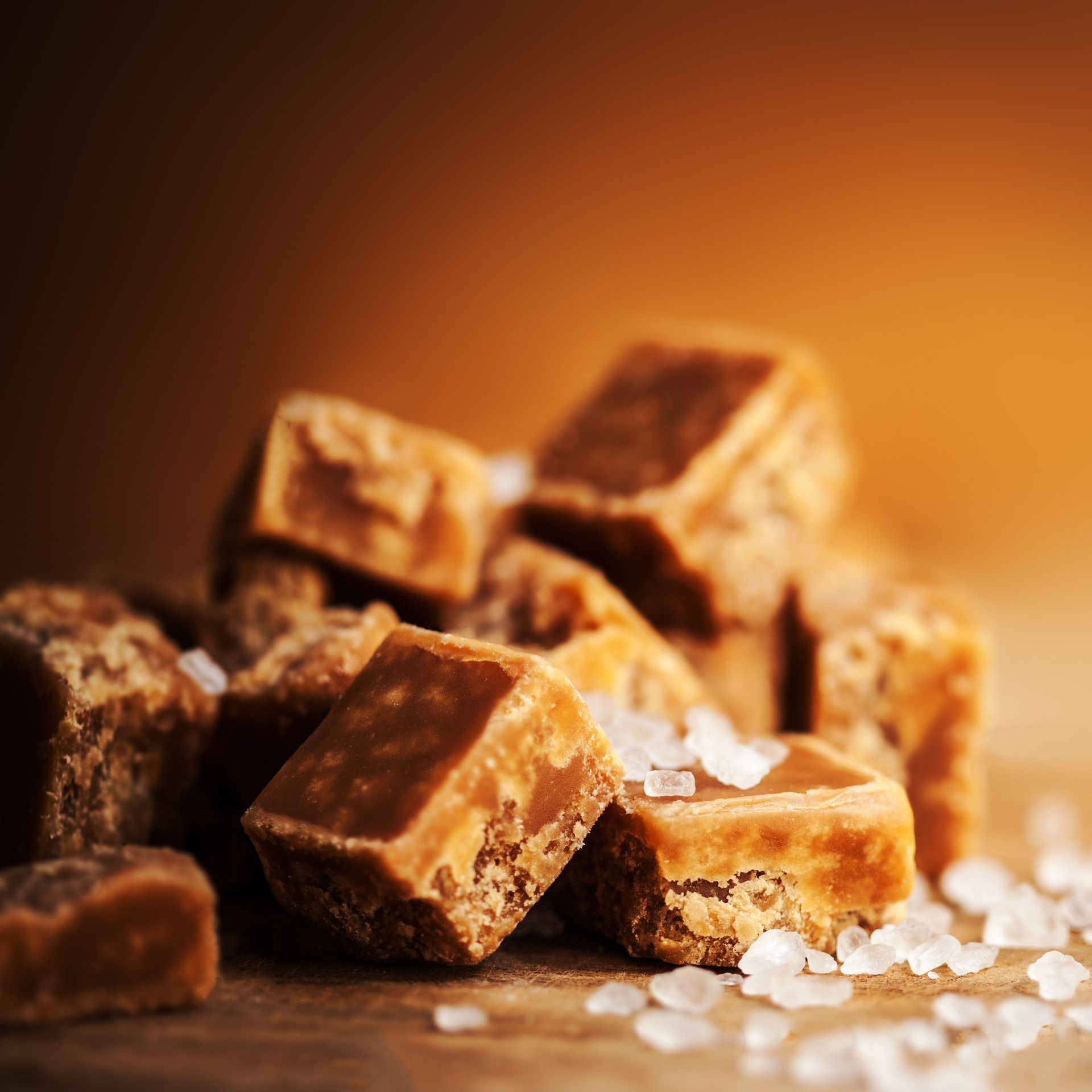 Close-up of a pile of square caramel candies
