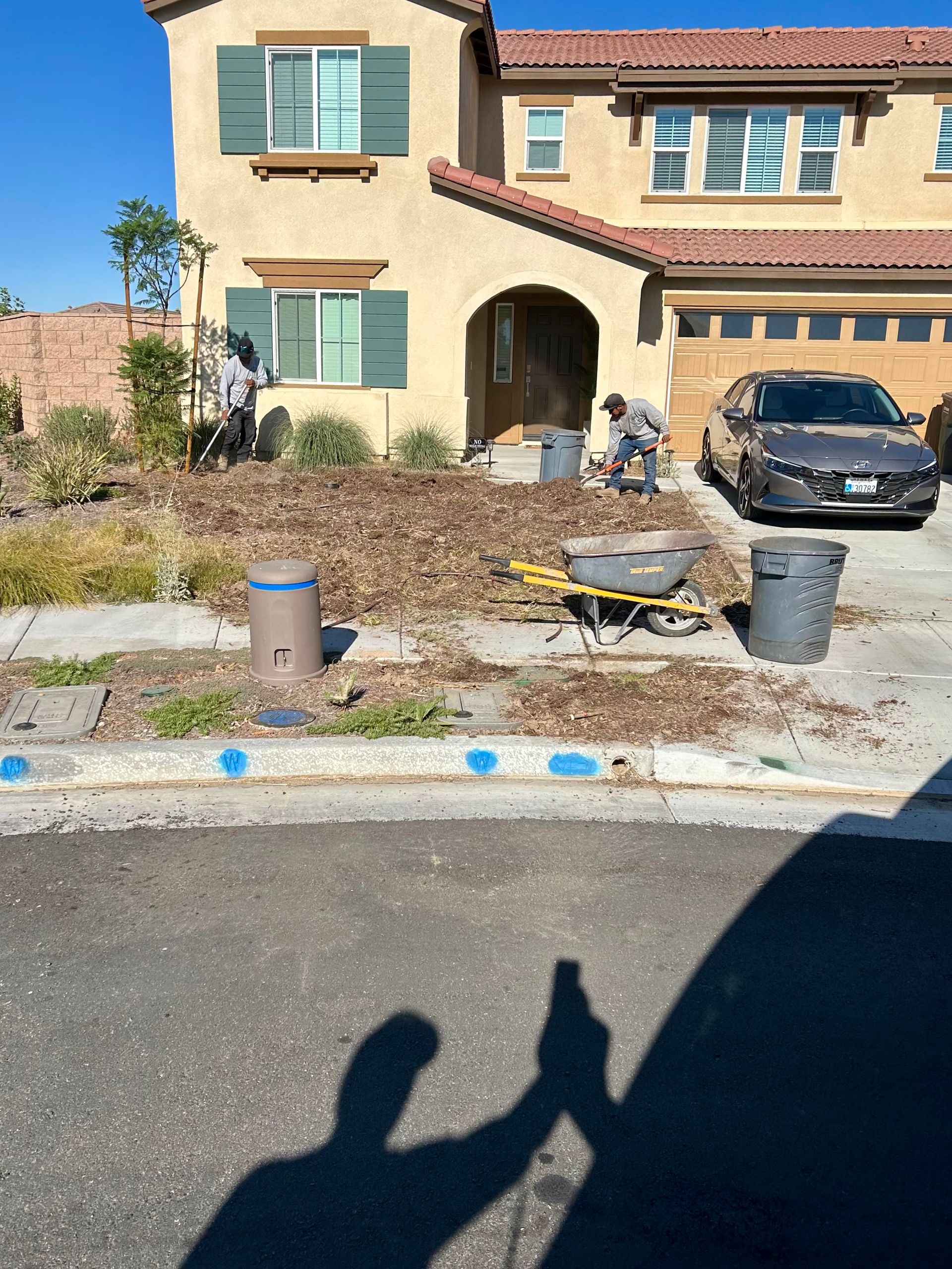 A house with a car parked in front of it