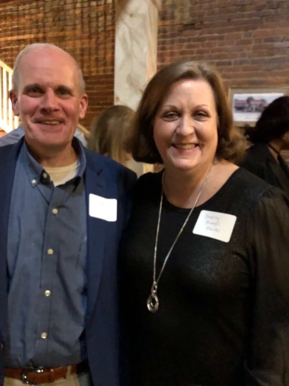A man and a woman are posing for a picture together