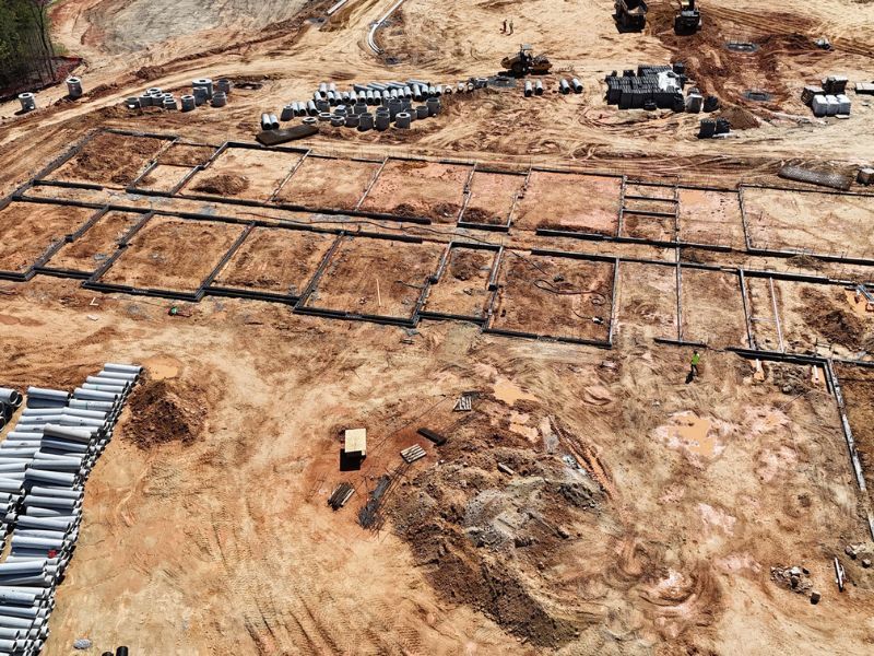 An aerial view of a construction site with a lot of dirt.