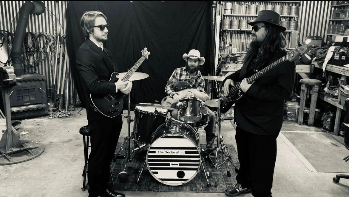 A large white building with a green awning over the entrance
