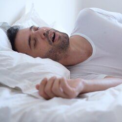 Sleep Disorders Information & Treatment Centers — Man Snoring While Sleeping in Burlington, IA