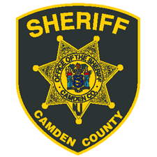 a sheriff 's badge from camden county is shown on a white background .
