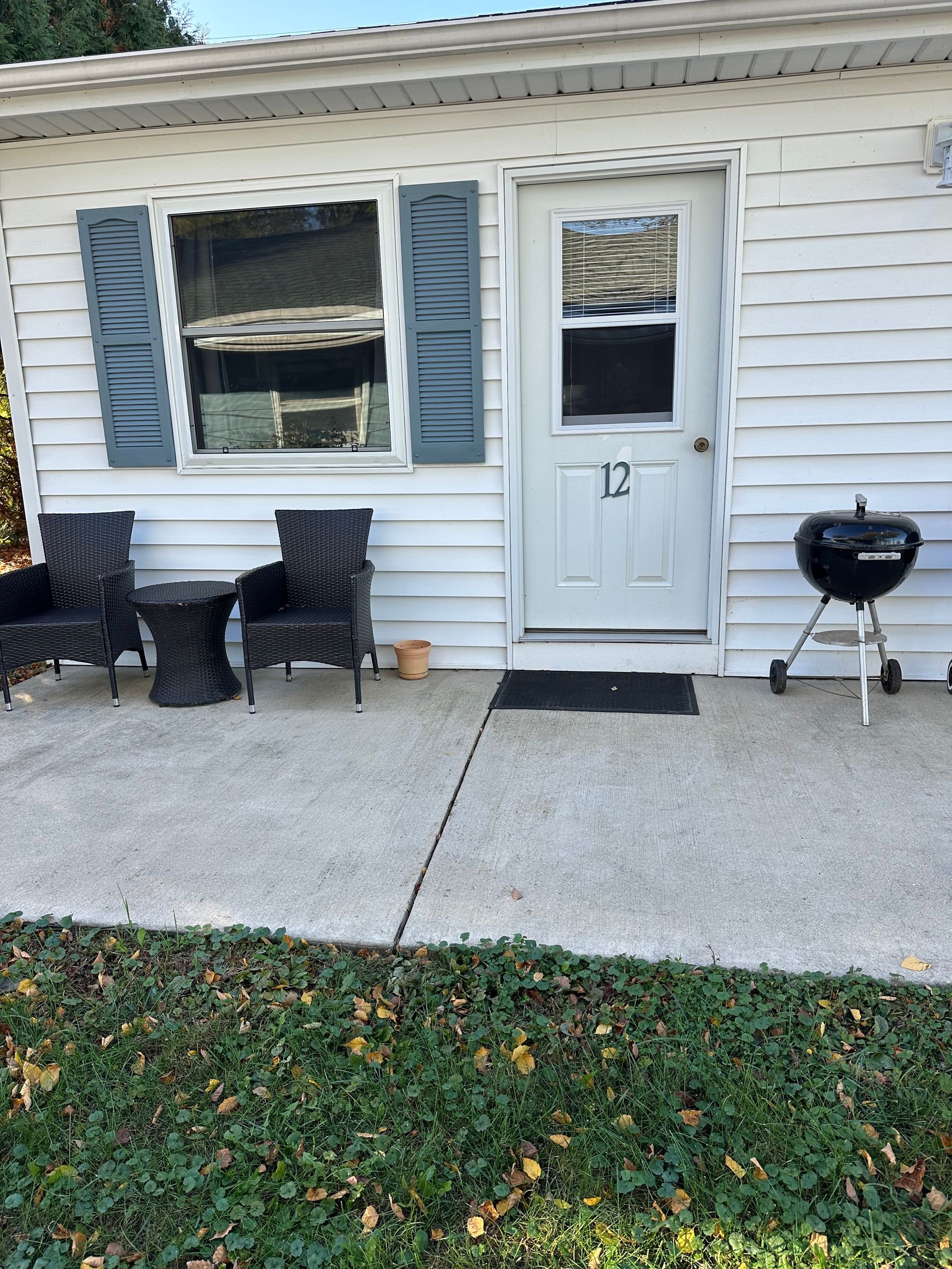 A white building with a door marked 