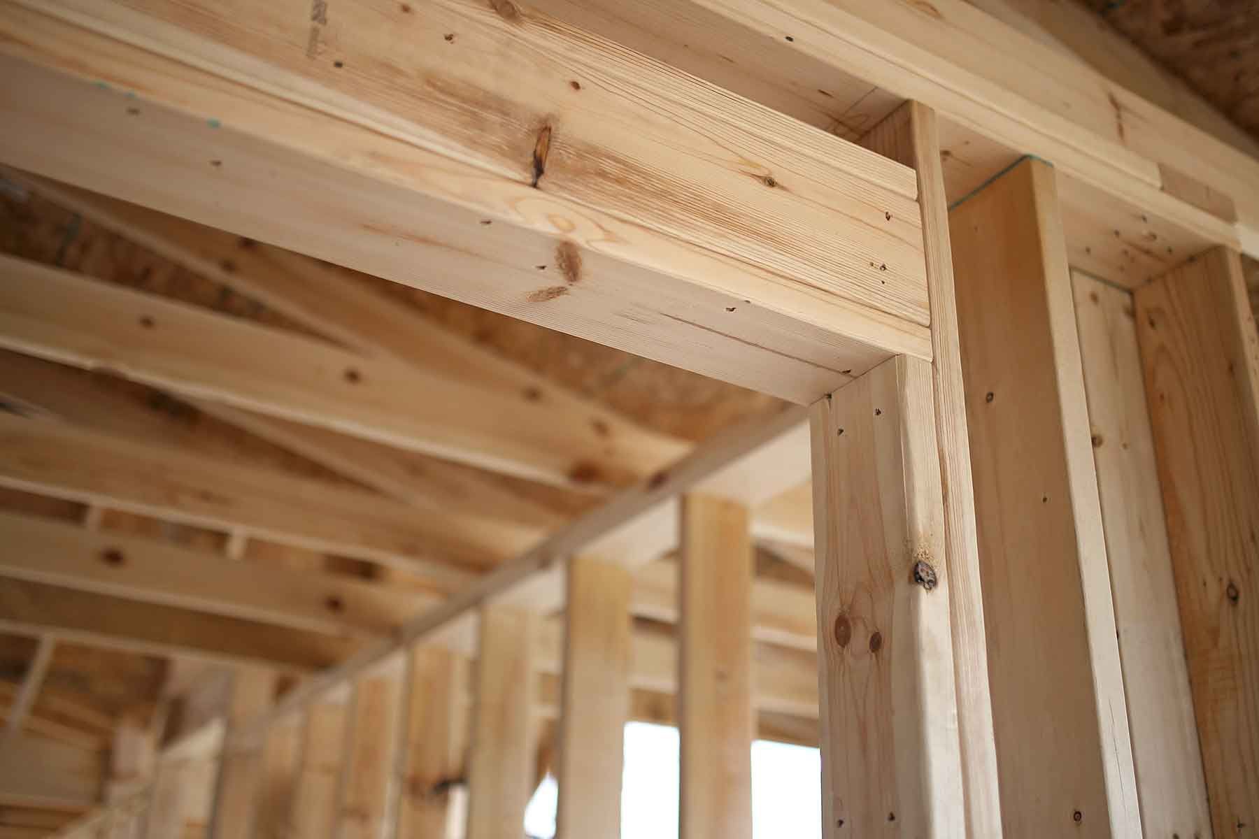 A close up of a wooden structure under construction.