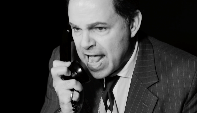 Bernie reacting angrily to phone conversation