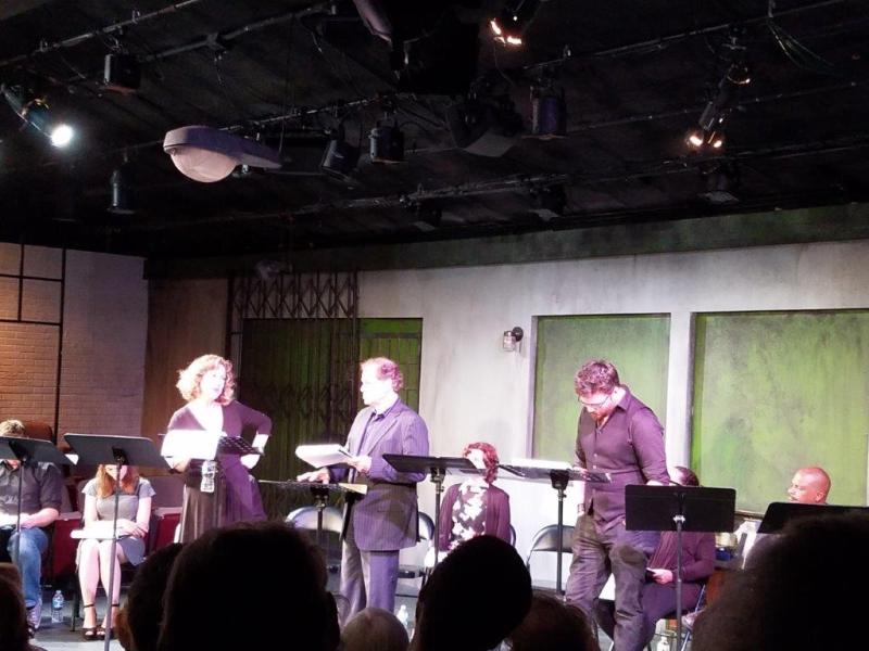 During a scene with 3 actors standing at music stands with scripts.