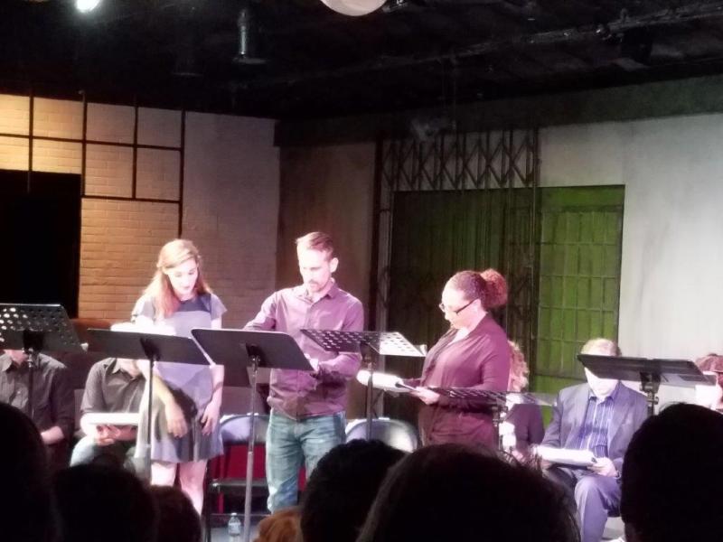 During a scene of The Little Foxes with 3 actors standing at music stands.
