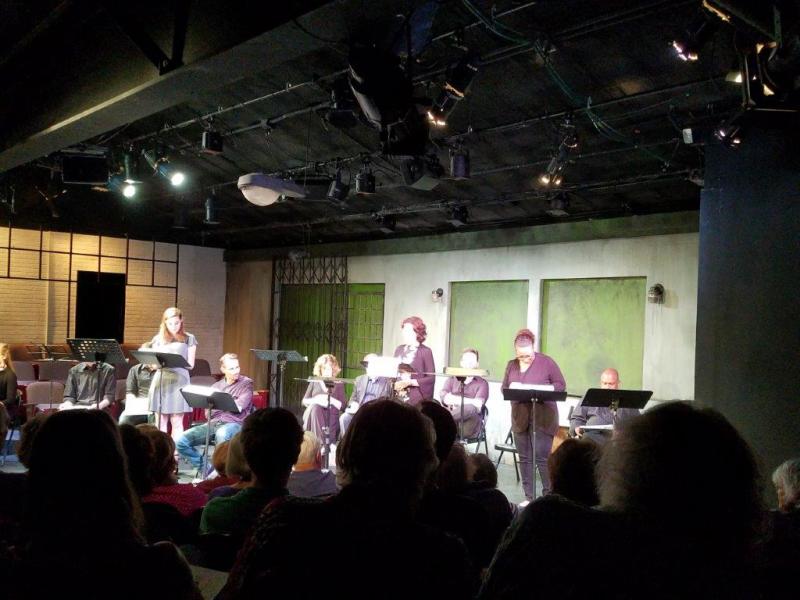 A view from the audience of actors presenting a scene from The Little Foxes.