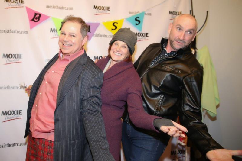 Audience members having fun in theatre lobby after play reading.