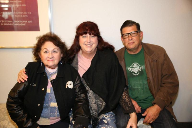 3 attendees in theatre lobby after play reading.