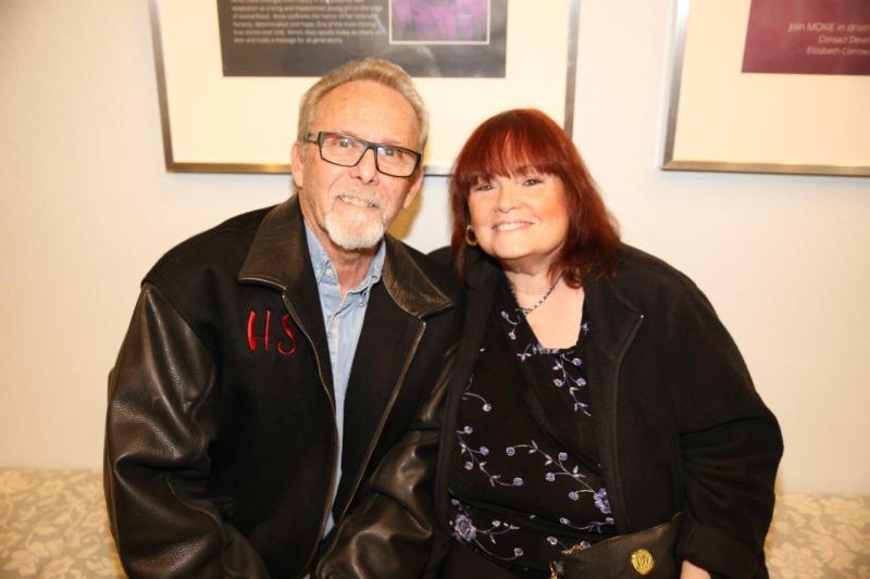 2 attendees seated in theatre lobby after play reading.