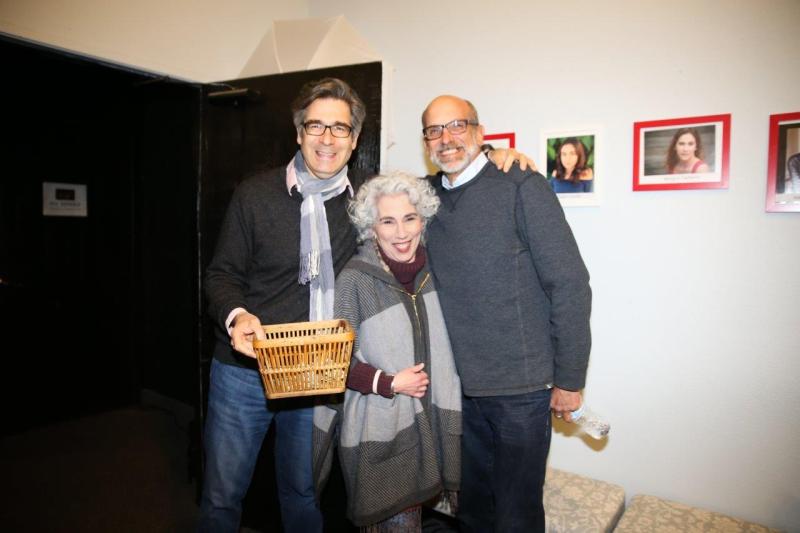 3 attendees visiting in theatre lobby after play reading.