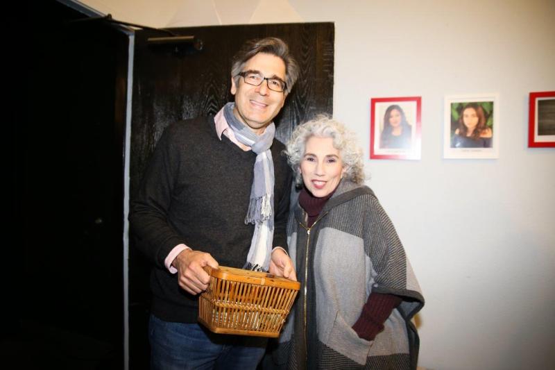 2 guests posing in theatre lobby after play reading.