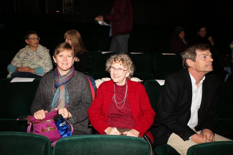 Attendees posing for picture in theatre before the reading.