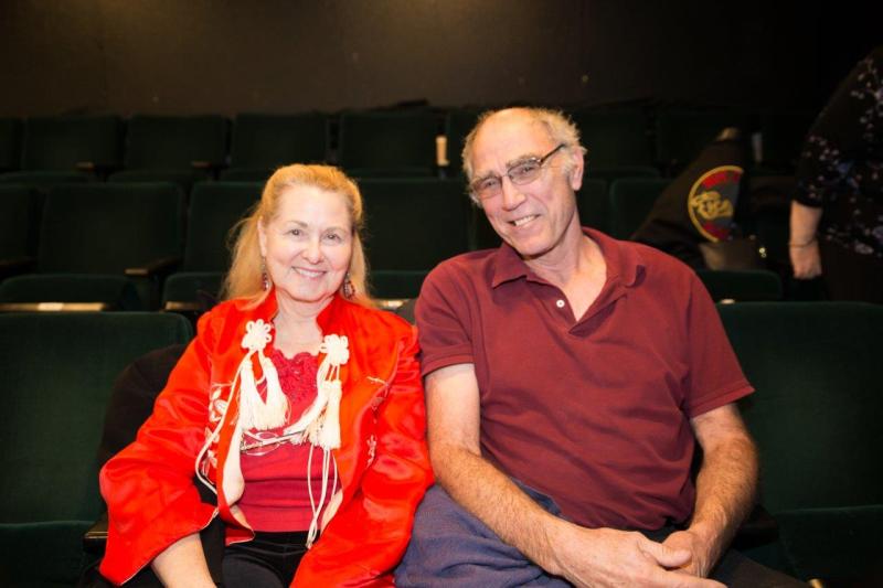 Attendees seated in theatre waiting for the reading to begin.