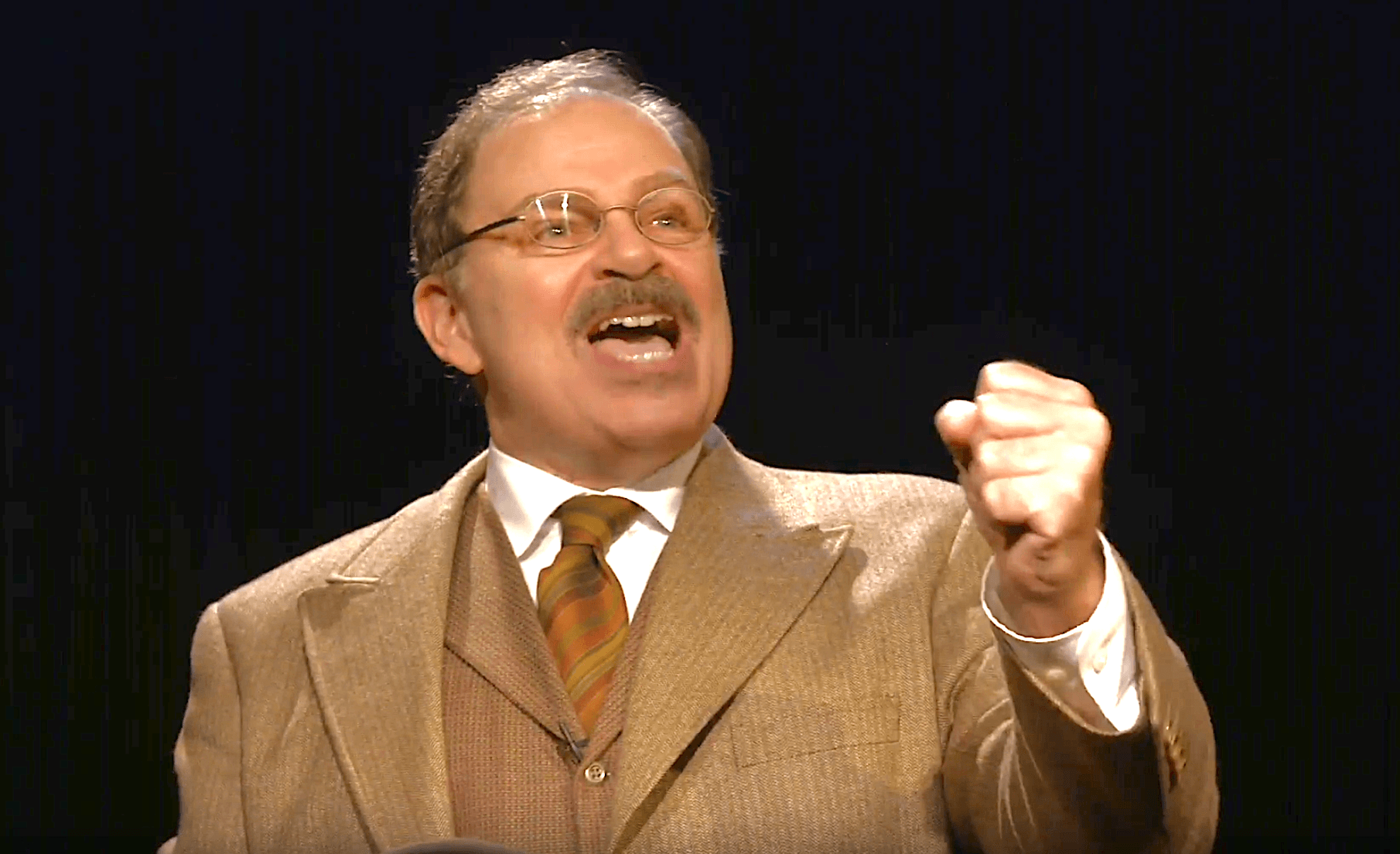 Actor Phil Johnson as President Theodore Roosevelt making a point to the crowd.