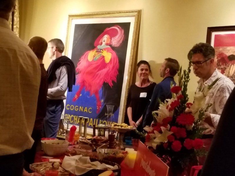 Party guests having a conversation in dining room