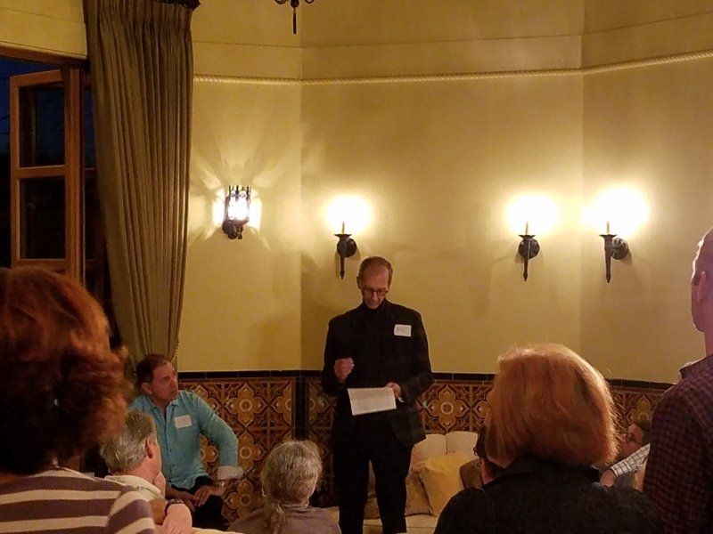 Will standing in living room sharing some thoughts with the guests