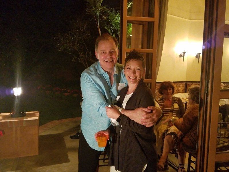 Guest and host Phil enjoying a hug in the living room