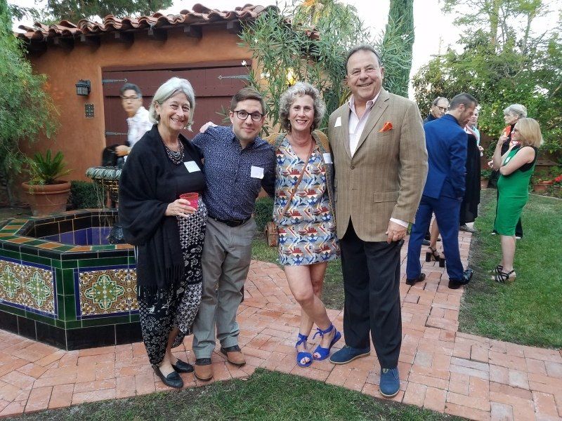 4 guests standing outdoors