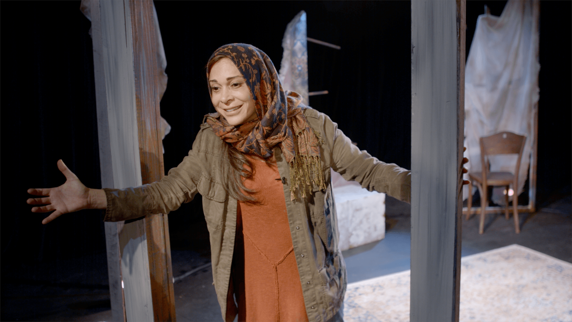 Young Mahshid smiling as she recalls a story.