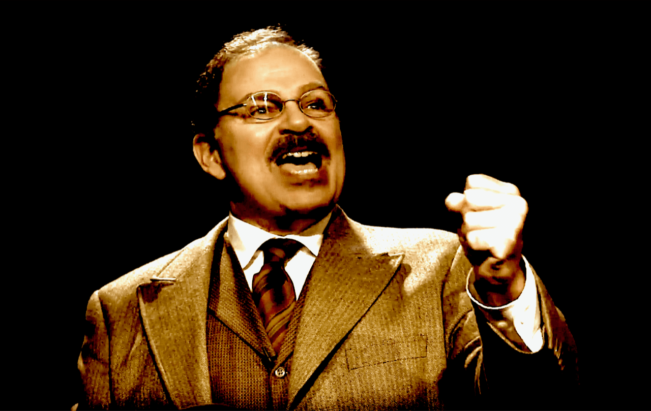 Actor Phil Johnson as President Theodore Roosevelt  speaking to the crowd.