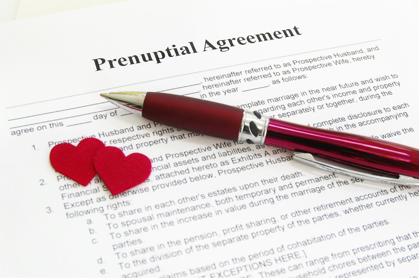 Prenuptial agreement document with pen