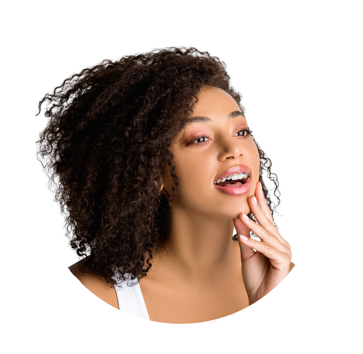 A woman with braces on her teeth is smiling.
