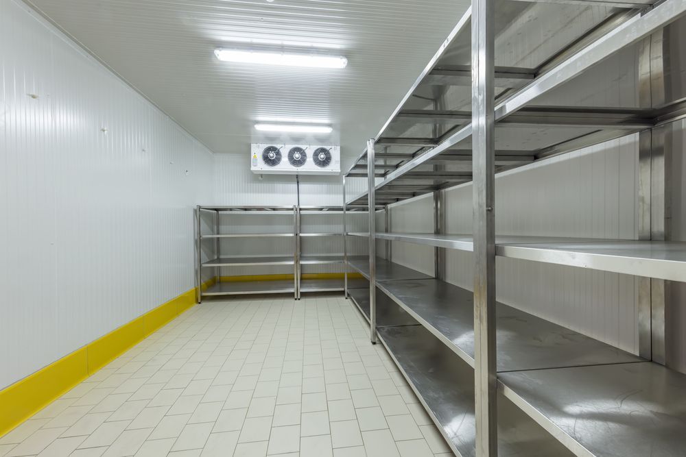 Empty Freezer Room With Stainless Steel Shelves — SealTite in Kingscliff, NSW