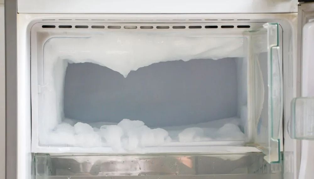 Inside of a White Freezer, Thick Ice Buildup on the Walls and Bottom — SealTite in Terranora, NSW