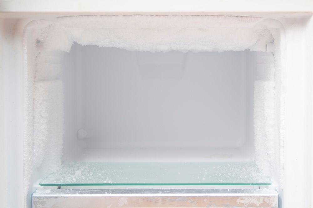 Empty Freezer With Frosted Interior and a Glass Shelf — SealTite in Kingscliff, NSW
