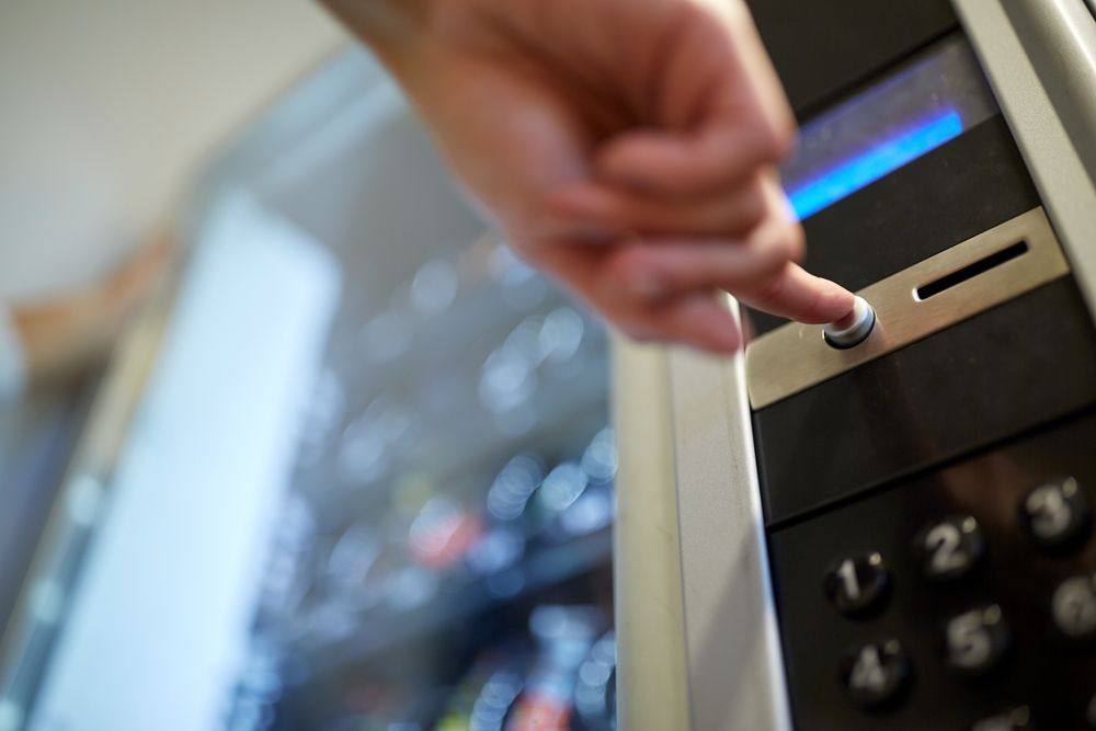 Hand Pressing Button on a Vending Machine — SealTite in Tweed Heads, NSW