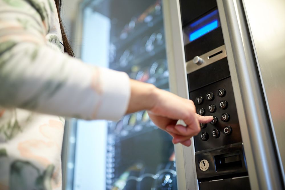 Person's Hand Pressing a Button on a Vending Machine Keypad — SealTite in Gold Coast, QLD