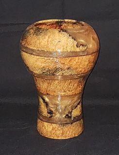 Wooden vase with blue resin interior and black dolphin silhouettes.