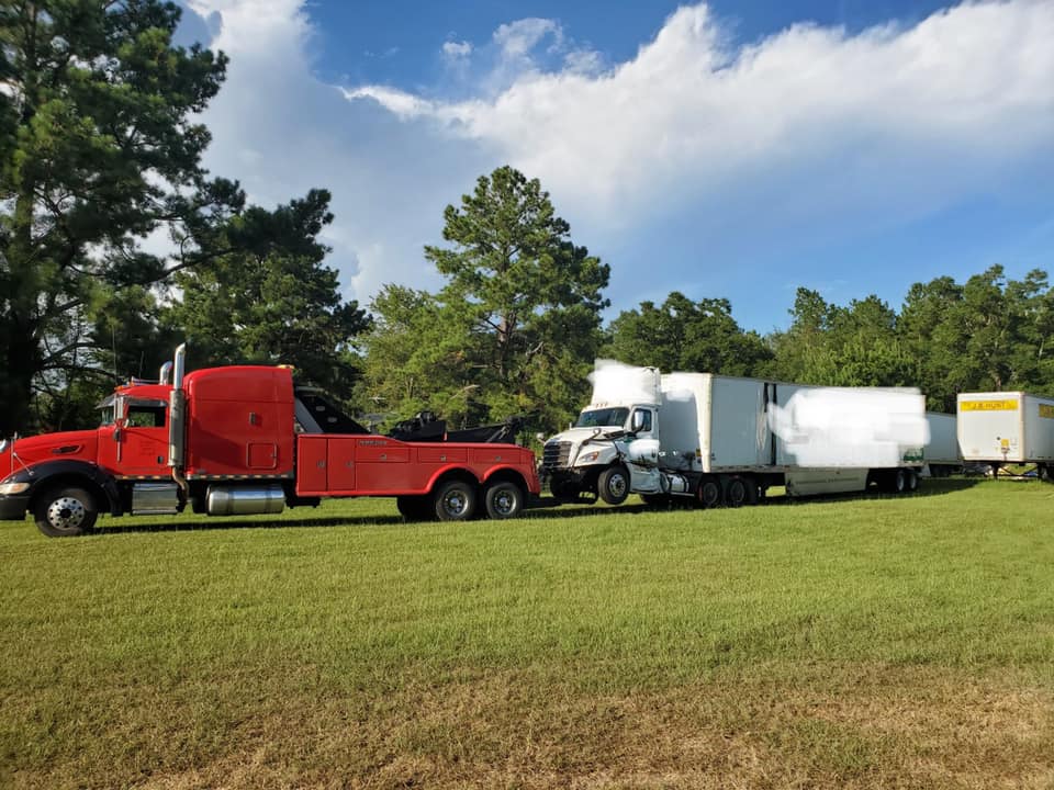 Trucks on Field — Valdosta, GA — GT’s Wrecker Service