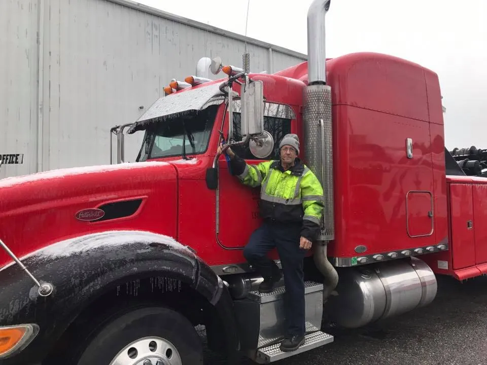 Man on Red Truck — Valdosta, GA — GT’s Wrecker Service