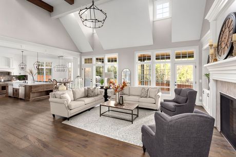 A living room filled with furniture and a fireplace.