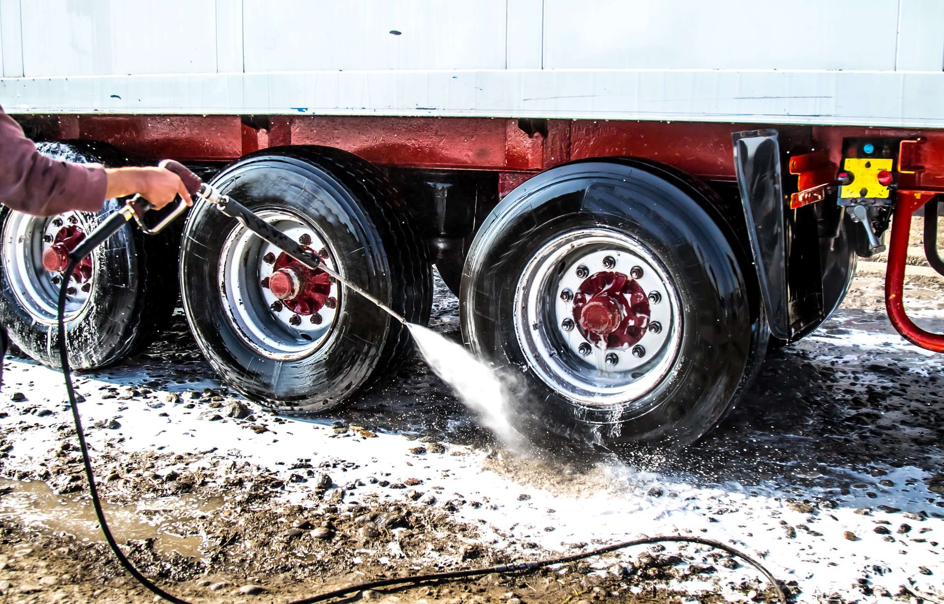 Power washing tires on commercial vehicles